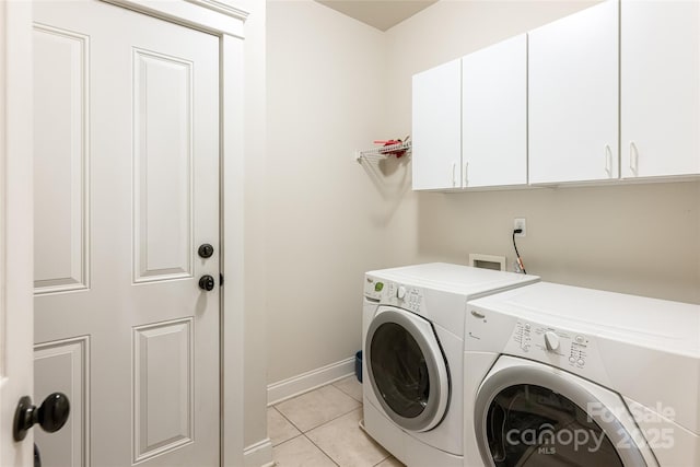 4 Yellow Owl Ct, Biltmore Lake, NC 28715 - washroom featuring cabinet space, washing machine and clothes dryer, light tile patterned floors, and baseboards