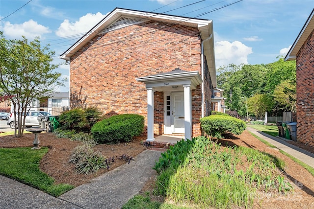 view of front of house featuring brick siding