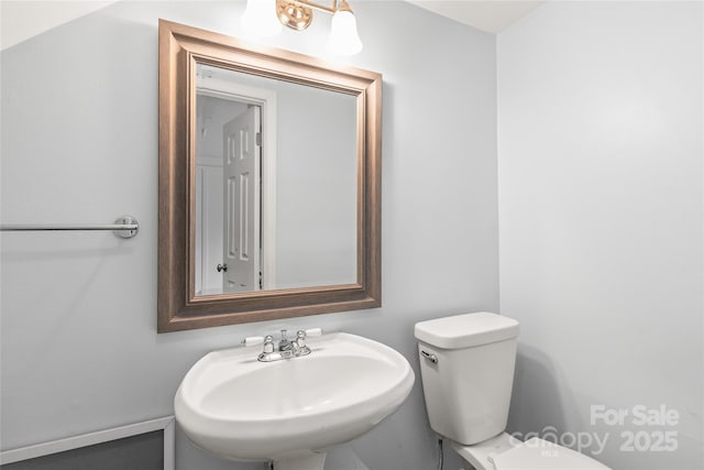 bathroom with a sink and toilet