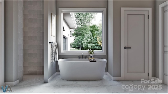 2601 Greenmont Cir, Belmont, NC 28012 - full bathroom featuring baseboards, a freestanding bath, marble finish floors, and tiled shower
