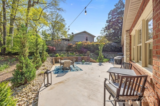 view of patio featuring fence