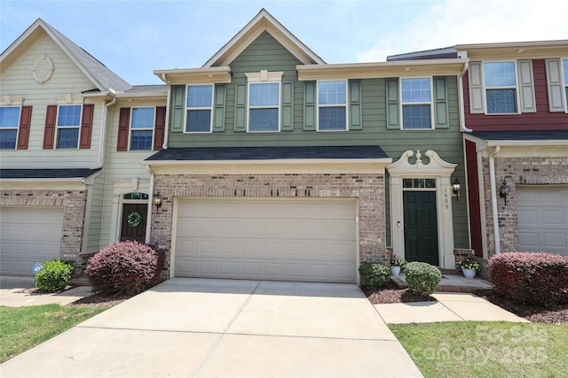 1809 Evergreen Dr, Charlotte, NC 28208 - townhome / multi-family property with an attached garage, driveway, and brick siding