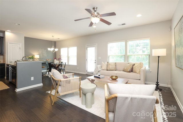 1809 Evergreen Dr, Charlotte, NC 28208 - living area featuring dark wood-style flooring, baseboards, ceiling fan, a chandelier, and recessed lighting