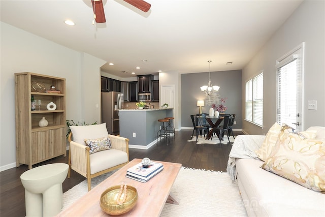1809 Evergreen Dr, Charlotte, NC 28208 - living area featuring dark wood finished floors, a chandelier, a ceiling fan, baseboards, and recessed lighting