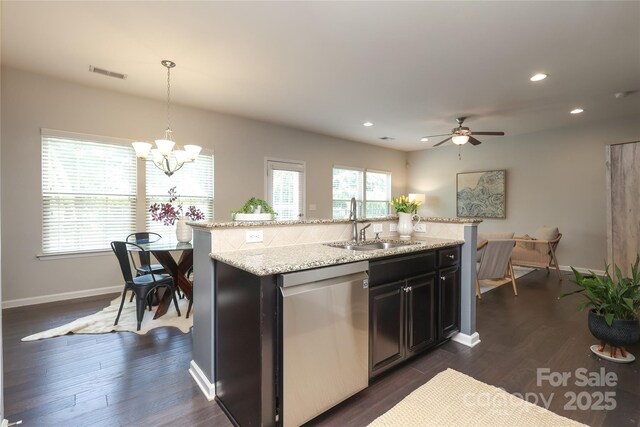 1809 Evergreen Dr, Charlotte, NC 28208 - kitchen featuring dishwasher, an island with sink, a chandelier, a sink, and recessed lighting