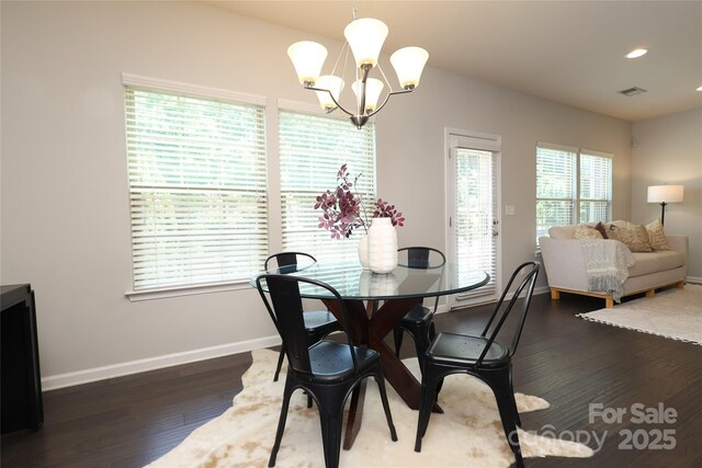 1809 Evergreen Dr, Charlotte, NC 28208 - dining room featuring a chandelier, wood finished floors, baseboards, and recessed lighting