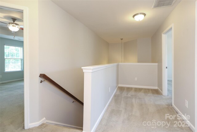 1809 Evergreen Dr, Charlotte, NC 28208 - hall featuring an upstairs landing, carpet flooring, and baseboards