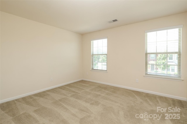 1809 Evergreen Dr, Charlotte, NC 28208 - spare room featuring baseboards and light colored carpet