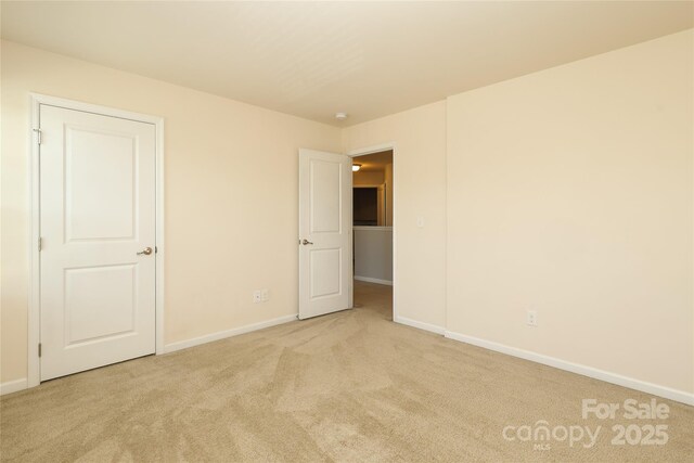 1809 Evergreen Dr, Charlotte, NC 28208 - unfurnished bedroom featuring carpet and baseboards