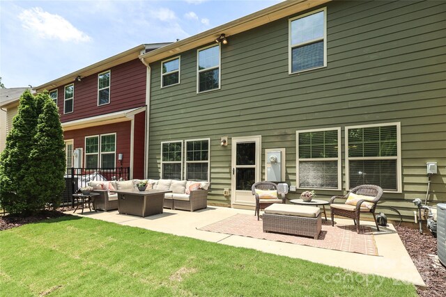 1809 Evergreen Dr, Charlotte, NC 28208 - rear view of property with an outdoor living space, a patio area, and a lawn