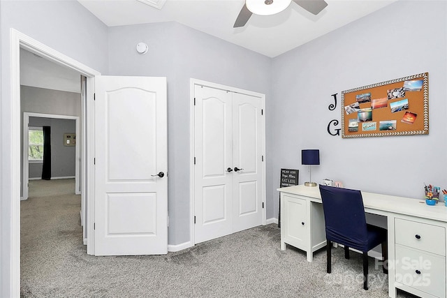 office featuring light carpet, ceiling fan, and baseboards
