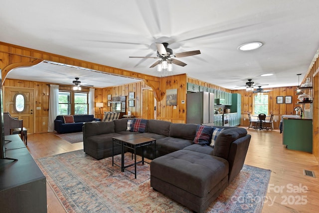 909 Pearson Falls Rd, Saluda, NC 28773 - living area featuring wood walls, a ceiling fan, and light wood finished floors