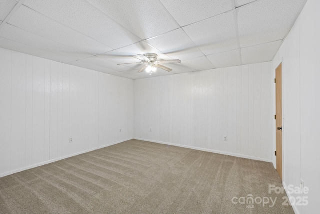 909 Pearson Falls Rd, Saluda, NC 28773 - empty room featuring a paneled ceiling, ceiling fan, carpet, and baseboards
