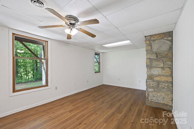 909 Pearson Falls Rd, Saluda, NC 28773 - unfurnished room featuring wood finished floors, baseboards, a paneled ceiling, and a ceiling fan