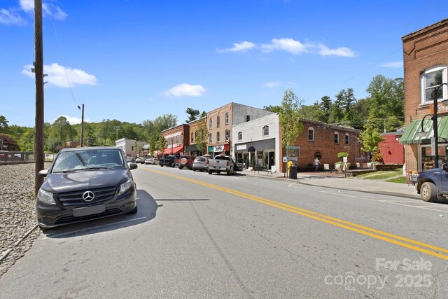 909 Pearson Falls Rd, Saluda, NC 28773 - view of asphalt street with sidewalks, curbs, and street lighting