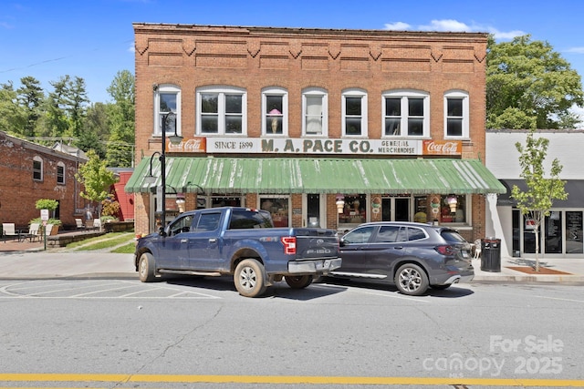 909 Pearson Falls Rd, Saluda, NC 28773 - view of front of home featuring brick siding