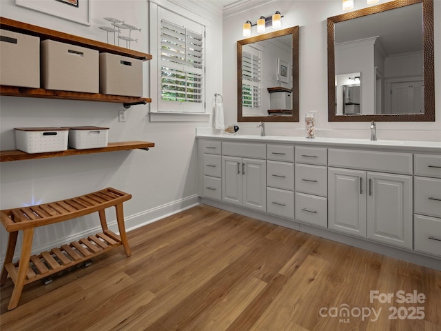 9 Dearborn St, Asheville, NC 28803 - full bath with crown molding, baseboards, wood finished floors, and double vanity