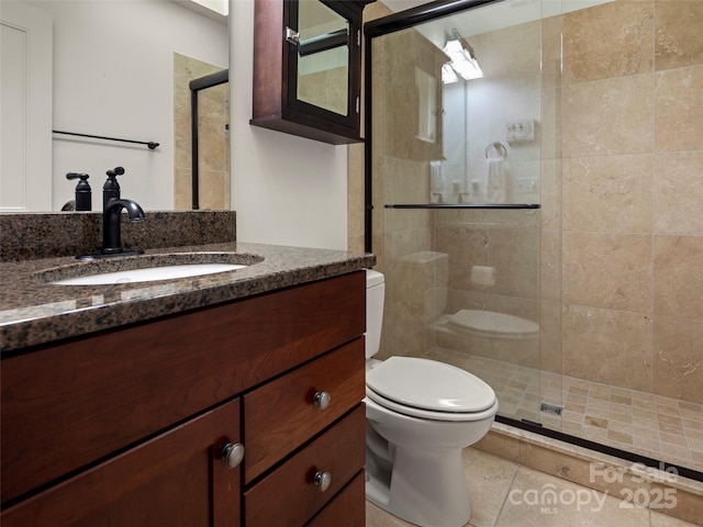 9 Dearborn St, Asheville, NC 28803 - bathroom with a stall shower, toilet, vanity, and tile patterned floors