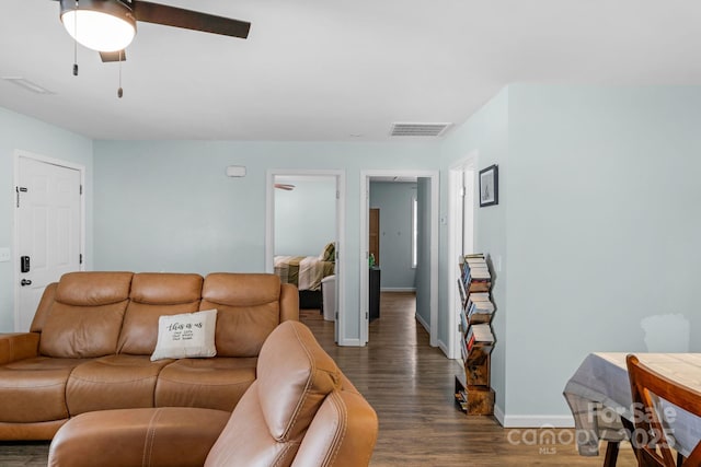 772 Austin Rd, New London, NC 28127 - living area featuring wood finished floors, baseboards, and a ceiling fan