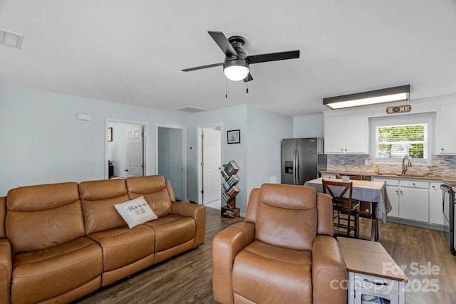 772 Austin Rd, New London, NC 28127 - living area featuring dark wood-style floors and ceiling fan
