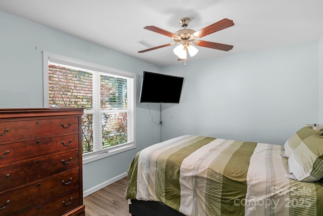 772 Austin Rd, New London, NC 28127 - bedroom featuring light wood-style flooring, baseboards, and ceiling fan