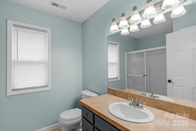 772 Austin Rd, New London, NC 28127 - bathroom featuring toilet, a stall shower, vanity, and baseboards