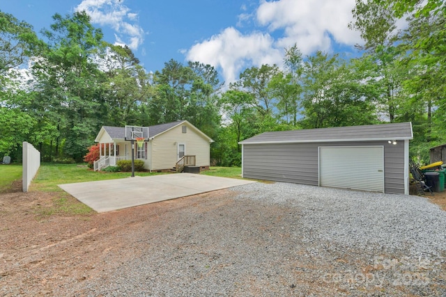 772 Austin Rd, New London, NC 28127 - view of front facade featuring an outbuilding, driveway, a garage, and a front yard