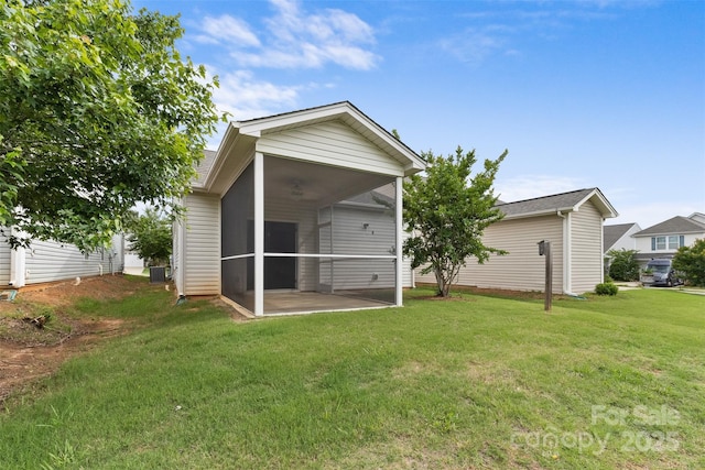 5076 Newport Lakes Dr, Rock Hill, SC 29732 - rear view of house featuring a sunroom, a yard, a patio, and central AC unit