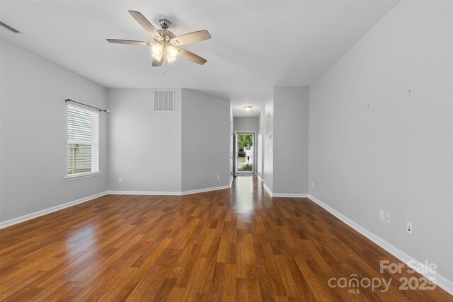 5076 Newport Lakes Dr, Rock Hill, SC 29732 - empty room featuring healthy amount of natural light, ceiling fan, wood finished floors, and baseboards