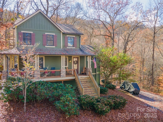 196 Juneberry Ln, Tuckasegee, NC 28783 - view of front of home with a porch, stairs, board and batten siding, and roof with shingles