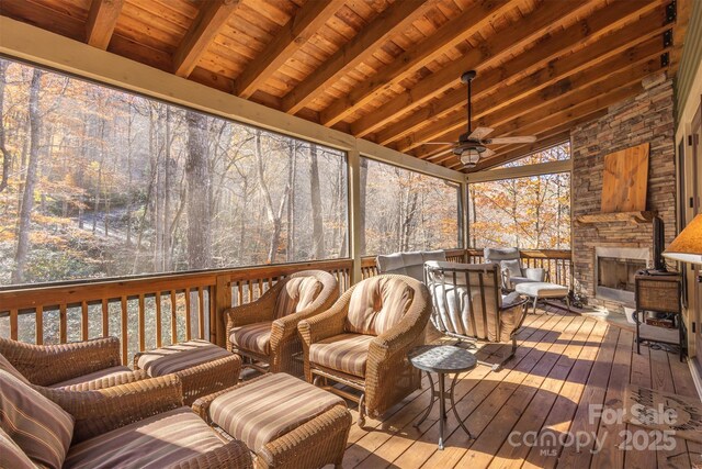 196 Juneberry Ln, Tuckasegee, NC 28783 - deck with ceiling fan and an outdoor living space with a fireplace