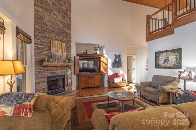 196 Juneberry Ln, Tuckasegee, NC 28783 - living area featuring a high ceiling, wood finished floors, and a fireplace
