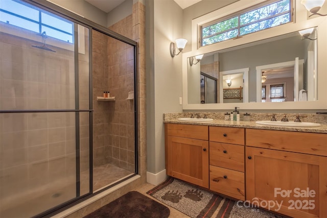 196 Juneberry Ln, Tuckasegee, NC 28783 - full bath with a stall shower, double vanity, and ceiling fan