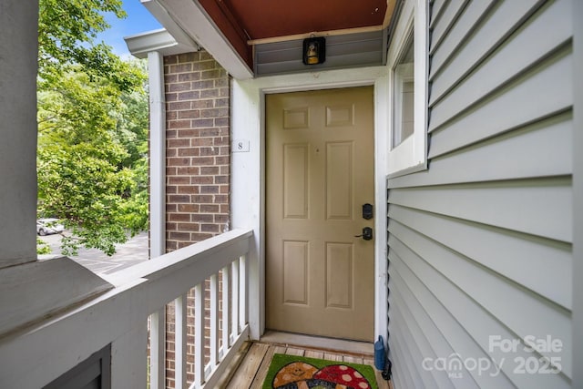 2502 Cranbrook Ln Unit 8, Charlotte, NC 28207 - doorway to property with brick siding