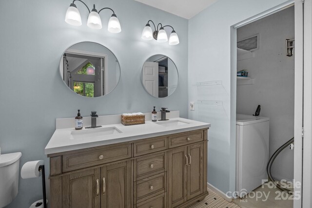 2502 Cranbrook Ln Unit 8, Charlotte, NC 28207 - bathroom with toilet, double vanity, and washer / clothes dryer
