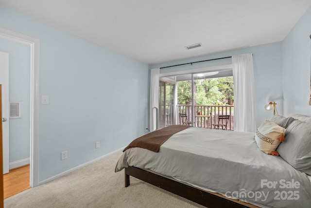 2502 Cranbrook Ln Unit 8, Charlotte, NC 28207 - carpeted bedroom with access to outside and baseboards