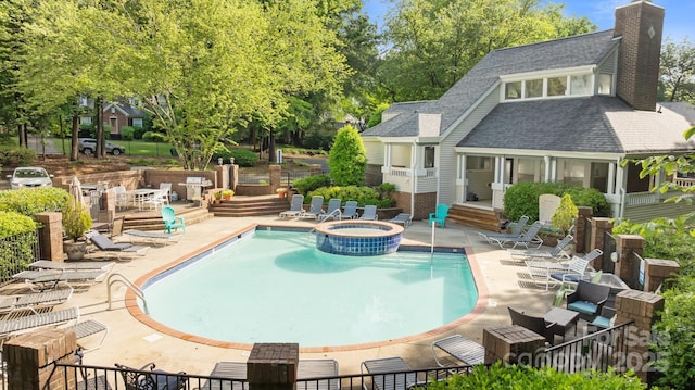 2502 Cranbrook Ln Unit 8, Charlotte, NC 28207 - view of swimming pool featuring a patio, a pool with connected hot tub, and fence