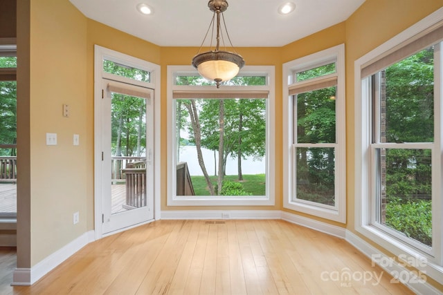 8216 Malibu Pointe Ln, Denver, NC 28037 - doorway with baseboards, light wood-style floors, recessed lighting, and a water view