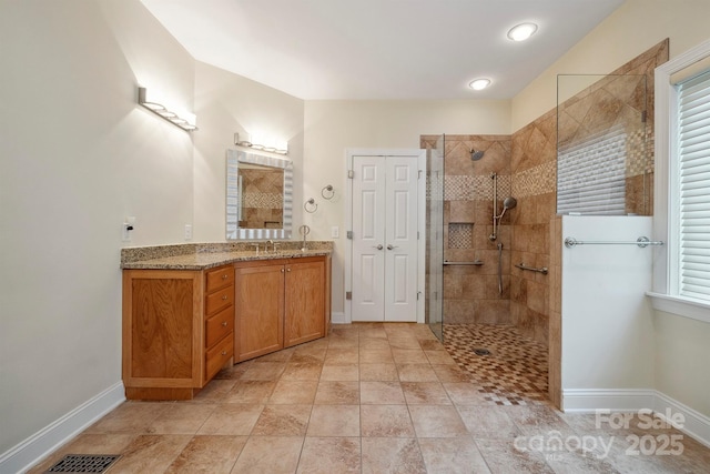 8216 Malibu Pointe Ln, Denver, NC 28037 - bathroom featuring baseboards, a walk in shower, and vanity