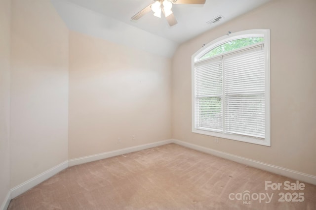8216 Malibu Pointe Ln, Denver, NC 28037 - empty room with a ceiling fan, baseboards, light carpet, and vaulted ceiling