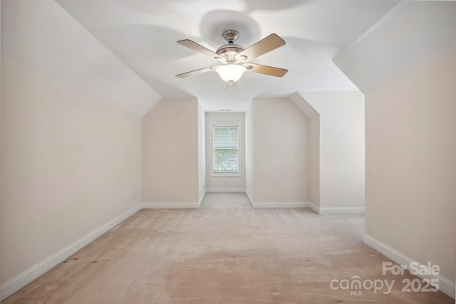 8216 Malibu Pointe Ln, Denver, NC 28037 - additional living space with ceiling fan, light colored carpet, lofted ceiling, and baseboards