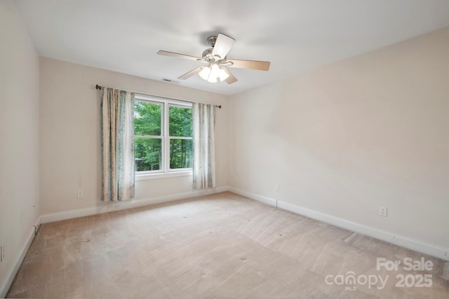 8216 Malibu Pointe Ln, Denver, NC 28037 - spare room featuring a ceiling fan, baseboards, and light carpet