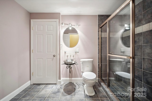 8216 Malibu Pointe Ln, Denver, NC 28037 - full bath featuring a stall shower, baseboards, toilet, and tile patterned floors