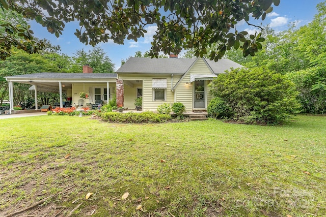 2556 Salem Church Rd, Lincolnton, NC 28092 - view of front facade with a chimney, a front yard, a carport, and driveway