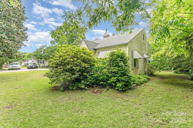 2556 Salem Church Rd, Lincolnton, NC 28092 - view of side of home with a lawn and a chimney