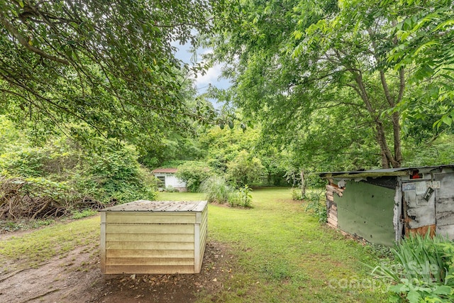 2556 Salem Church Rd, Lincolnton, NC 28092 - view of grassy yard with a storage unit and an outbuilding