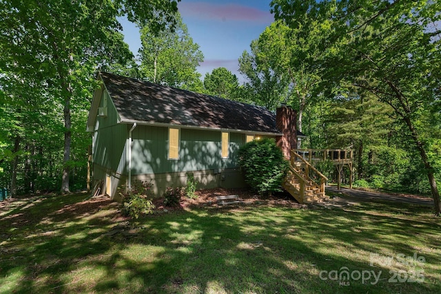 52 Reynolda Dr, Asheville, NC 28803 - view of home's exterior with stairway, a lawn, a deck, and a chimney