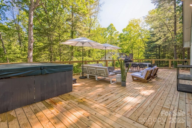 52 Reynolda Dr, Asheville, NC 28803 - deck with a hot tub, an outdoor living space, and view of wooded area