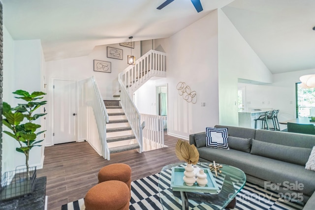 52 Reynolda Dr, Asheville, NC 28803 - living area with stairs, wood finished floors, high vaulted ceiling, ceiling fan, and baseboards