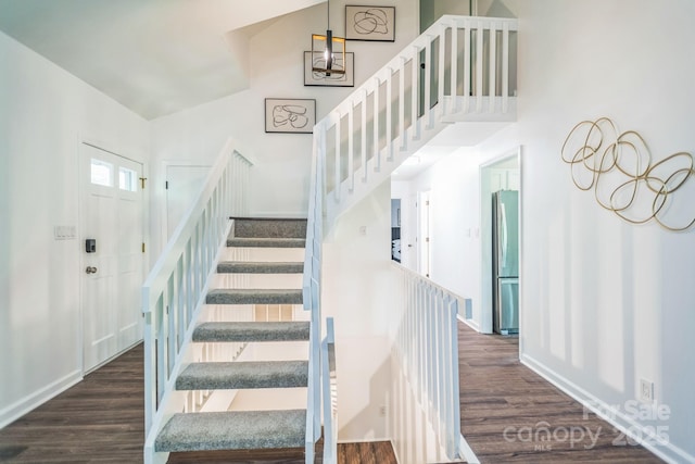 52 Reynolda Dr, Asheville, NC 28803 - staircase featuring wood finished floors, a towering ceiling, and baseboards